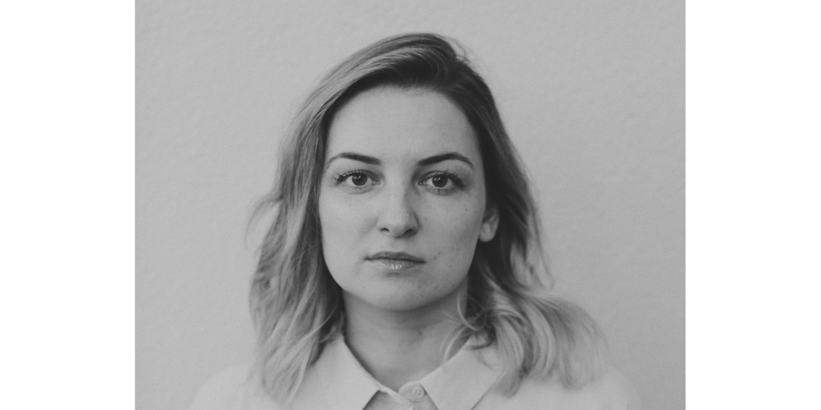 Black-and-white close-up portrait of Unundone’s founder, creator of emotionally resonant hand-poured candles.